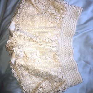 Women’s cream shorts, with design